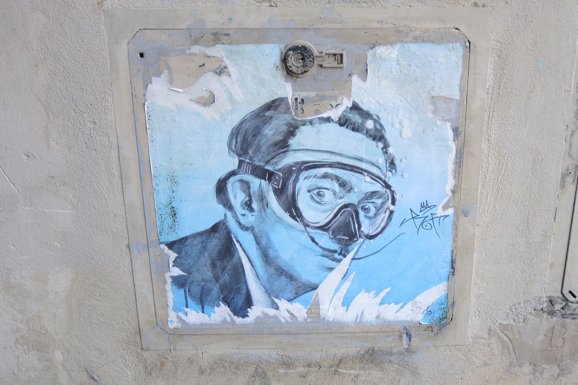 Street art van artiest BLUB in Florence Toscone Italië Dali met duikbril 